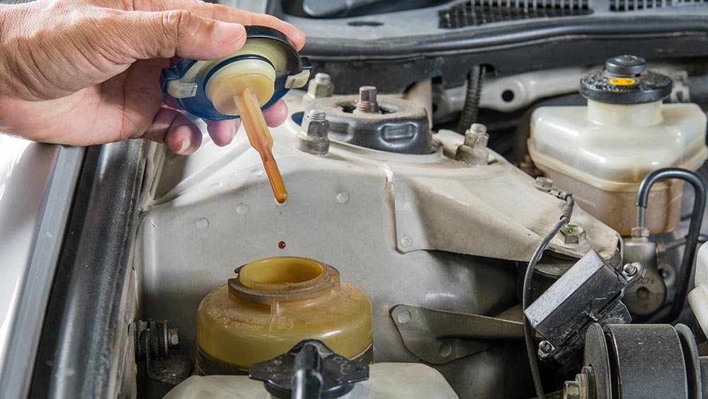 Fluids being checked while performing rv inspection services